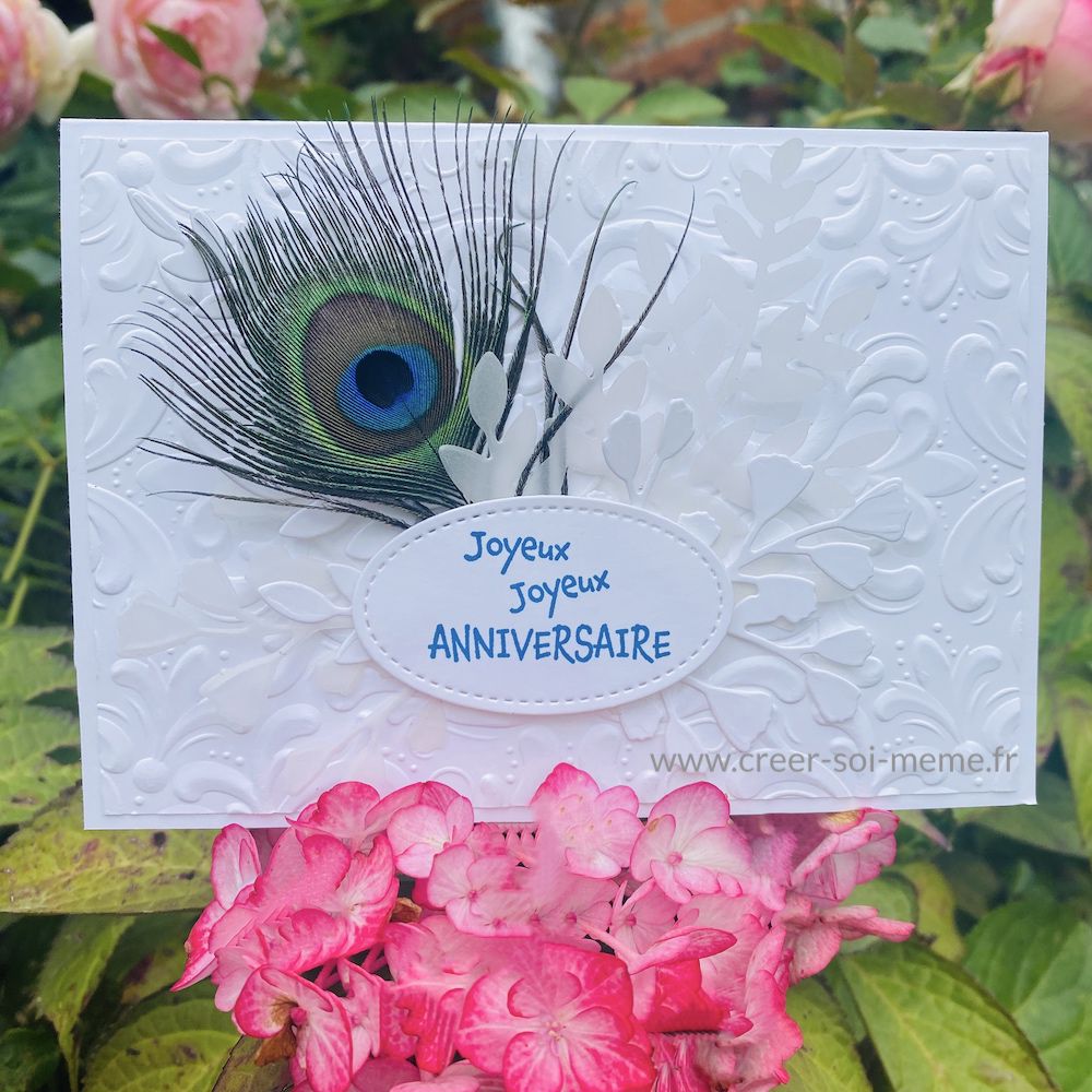 carte d'anniversaire avec plume naturelle de paon